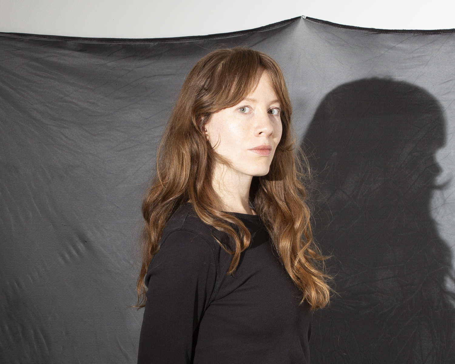 Adjunct Instructor Kathryn Bawden standing in front of a photo back drop Adjunct Instructor Kathryn Bawden standing in front of a photo back drop